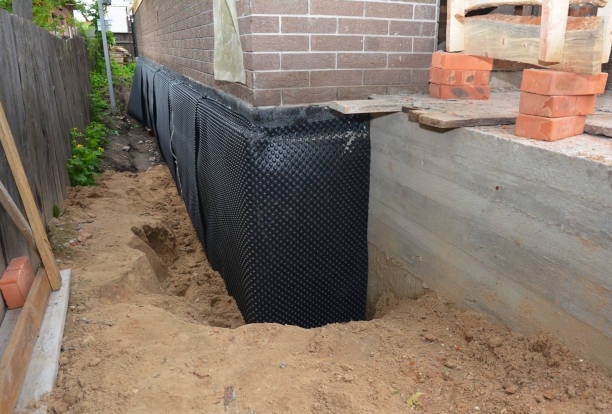 SJ Waterproofing Pros technician performing targeted Exterior Waterproofing assessment in Yorkshire, VA